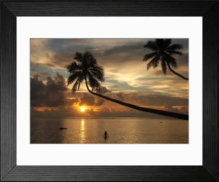 Framed Print : Silhouette of leaning palm trees and a woman at sunrise on Taveuni Island, Fiji, Pacific Framed Print : Silhouette of leaning palm trees and a woman at sunrise on Taveuni Island, Fiji, Pacific