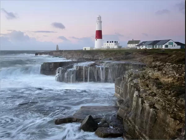 Rough seas crash over rocks near Portland Bill Lighthouse, Dorset, England, United Kingdom