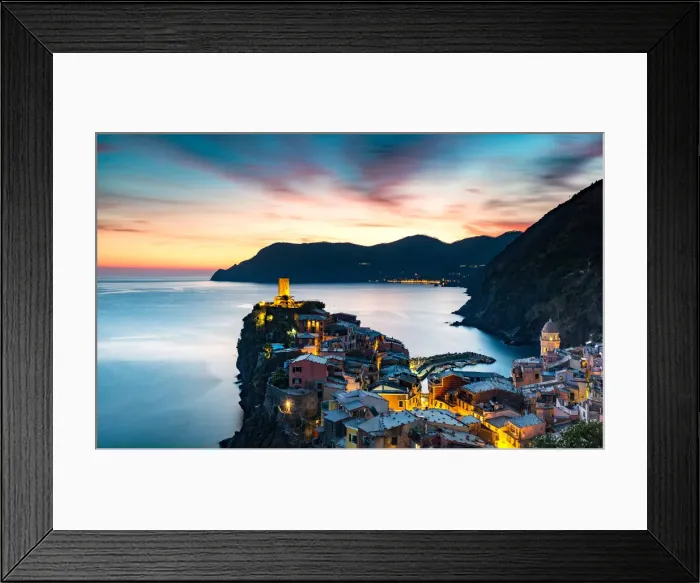 Framed Print : Long exposure at blue hour to capture the end of a stunning sunset and the lights of the old town
