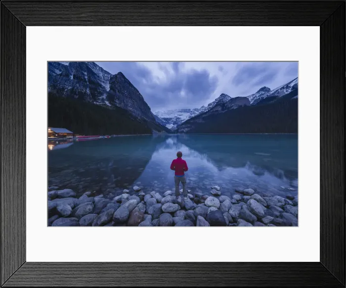 Framed Print : Lone traveler at Lake Louise in the morning, Banff National Park, UNESCO World Heritage Site Framed Print : Lone traveler at Lake Louise in the morning, Banff National Park, UNESCO World Heritage Site