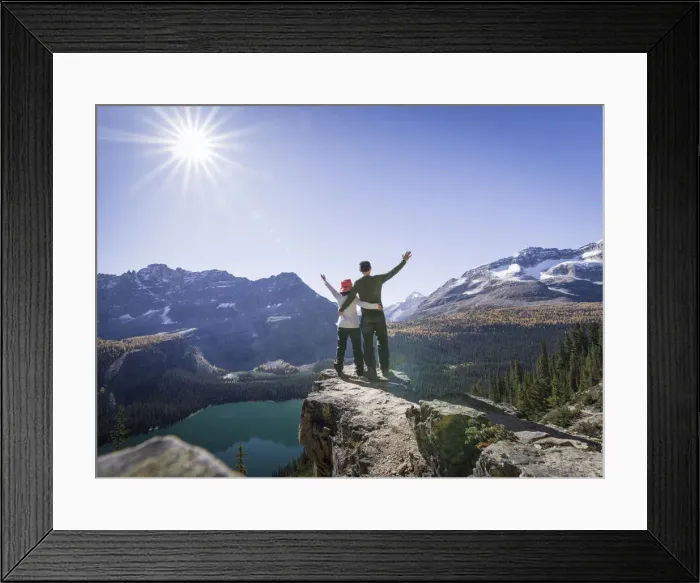 Framed Print : Hiker couple at the Alpine circuit trail looking down the Lake O Hara, Yoho National Park Framed Print : Hiker couple at the Alpine circuit trail looking down the Lake O Hara, Yoho National Park
