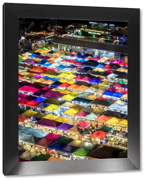 Colourful food stalls and tents at the Ratchada Night Train Market in Bangkok, Thailand