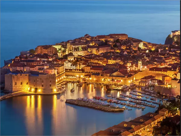 Aerial view of Old Port and Dubrovnik Old Town at night, UNESCO World Heritage Site