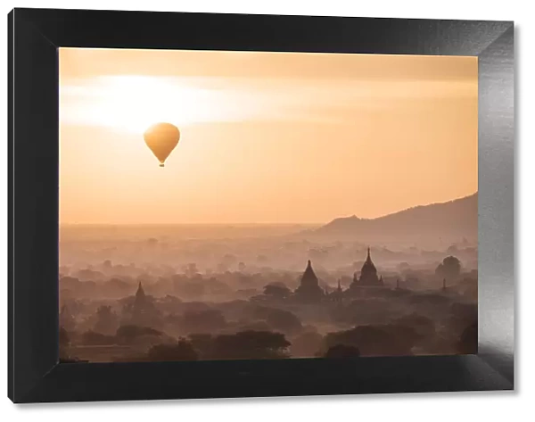 View of hot air balloon and temples at dawn, Bagan (Pagan), Mandalay Region, Myanmar (Burma)