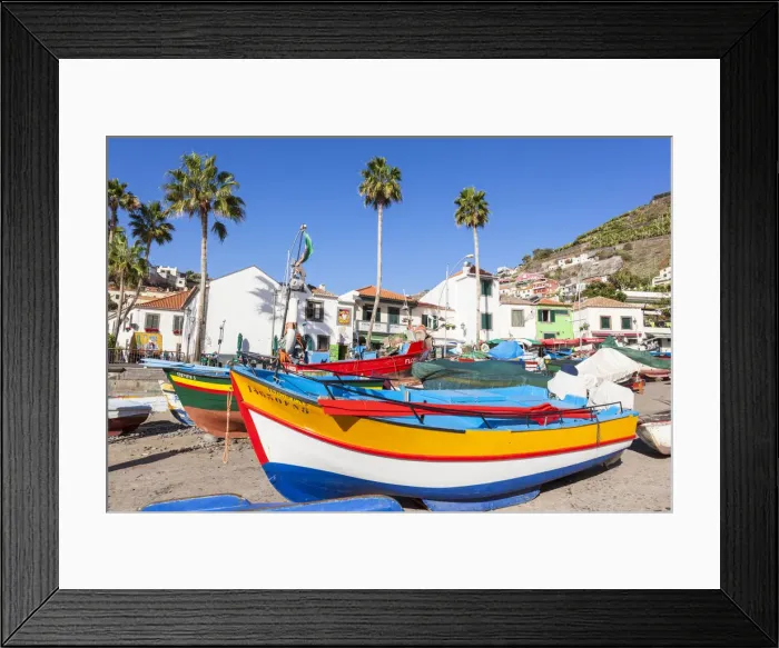 Framed Print : Traditional colourful fishing boats on the beach in Camara de Lobos fishing village