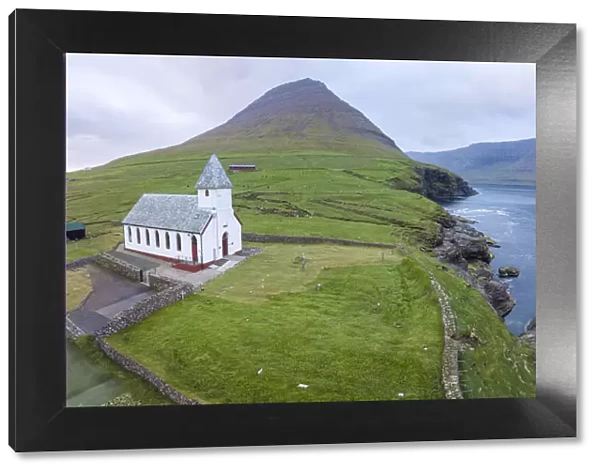 Panoramic of Church of Vidareidi by the sea, Vidoy Island, Faroe Islands, Denmark