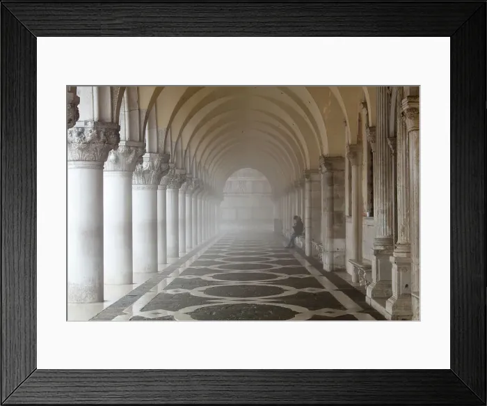 Framed Print : Misty view of pillars with lone woman sitting, Doges Palace, St. Marks Square, Venice Framed Print : Misty view of pillars with lone woman sitting, Doges Palace, St. Marks Square, Venice