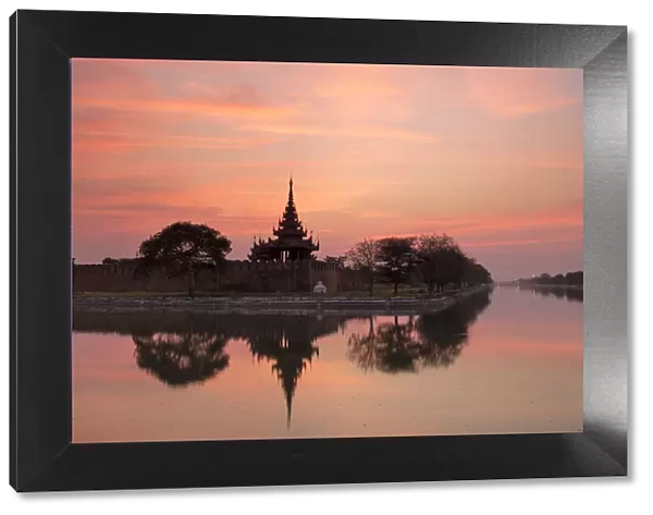 Sunset view of the Royal Palace, City Moat and City Wall in Mandalay, Myanmar (Burma)