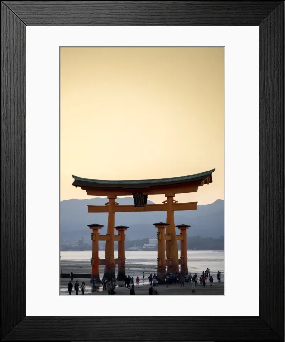 Framed Print : Tourists walking under the torii gate of Miyajima at low tide, Itsukushima, UNESCO