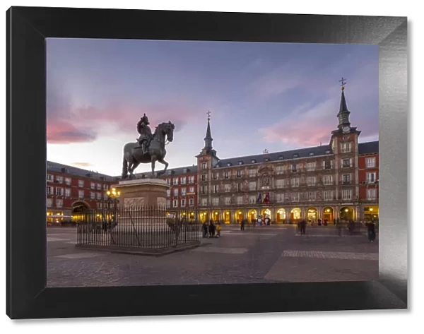 View of Philip lll statue and architecture in Calle Mayor at dusk, Madrid, Spain, Europe