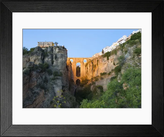 Framed Print : Puente Nuevo (New Bridge) floodlit at night and the white town perched on cliffs Framed Print : Puente Nuevo (New Bridge) floodlit at night and the white town perched on cliffs