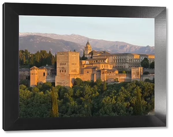 The Alhambra, UNESCO World Heritage Site, and Sierra Nevada mountains in evening