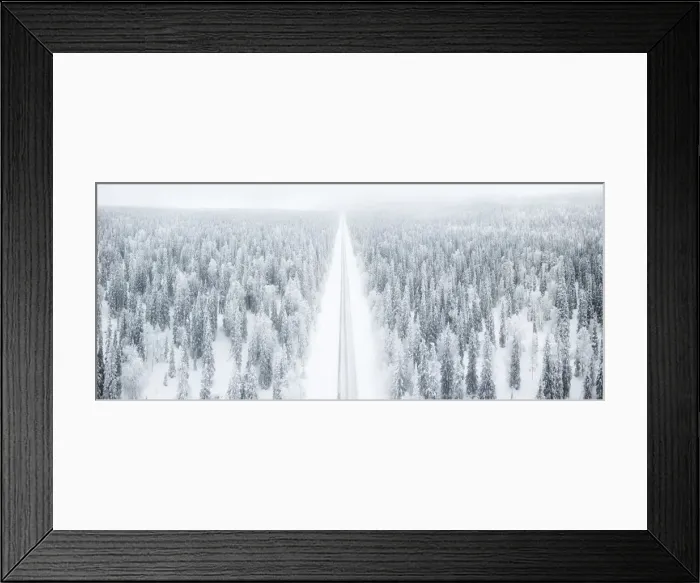 Framed Print : Elevated panoramic view of road along the snow covered forest, Pallas-Yllastunturi National Park Framed Print : Elevated panoramic view of road along the snow covered forest, Pallas-Yllastunturi National Park