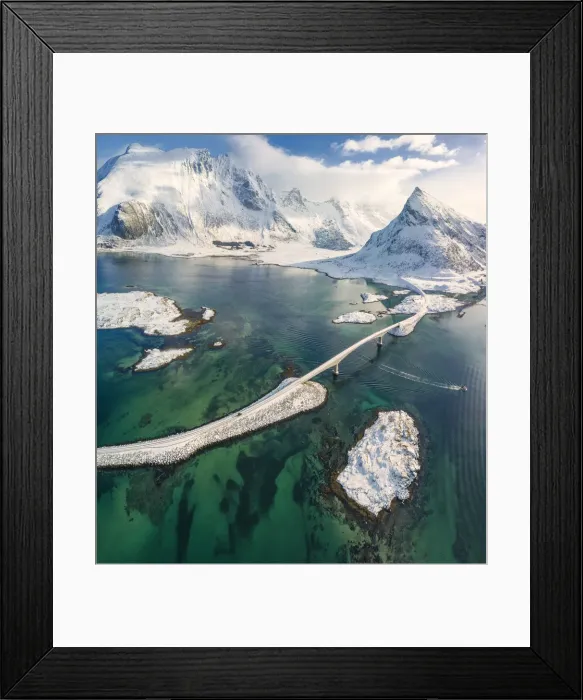 Framed Print : Aerial panoramic view of snowy peak of Volanstinden and Fredvang bridge, Lofoten Islands Framed Print : Aerial panoramic view of snowy peak of Volanstinden and Fredvang bridge, Lofoten Islands