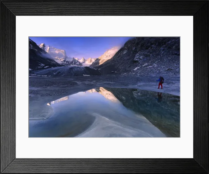 Framed Print : Hiker looks at sunrise from a pond at Forno Glacier, Forno Valley, Maloja Pass, Engadine Framed Print : Hiker looks at sunrise from a pond at Forno Glacier, Forno Valley, Maloja Pass, Engadine