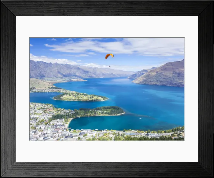 Framed Print : Aerial view of Queenstown, paraglider, Lake Wakatipu and The Remarkables mountains Framed Print : Aerial view of Queenstown, paraglider, Lake Wakatipu and The Remarkables mountains