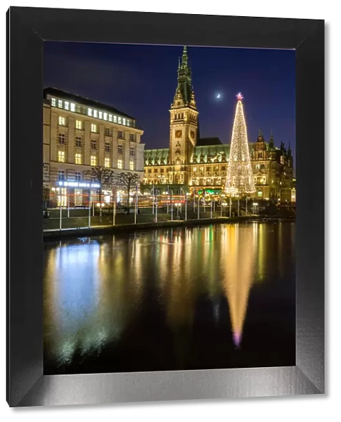 Reflection of Hamburgs Town Hall (Rathaus) and Christmas Market at blue hour, Hamburg