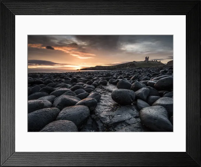 Framed Print : Dawn light reflecting on the rocks at Dunstanburgh Castle on the North East Coast Framed Print : Dawn light reflecting on the rocks at Dunstanburgh Castle on the North East Coast