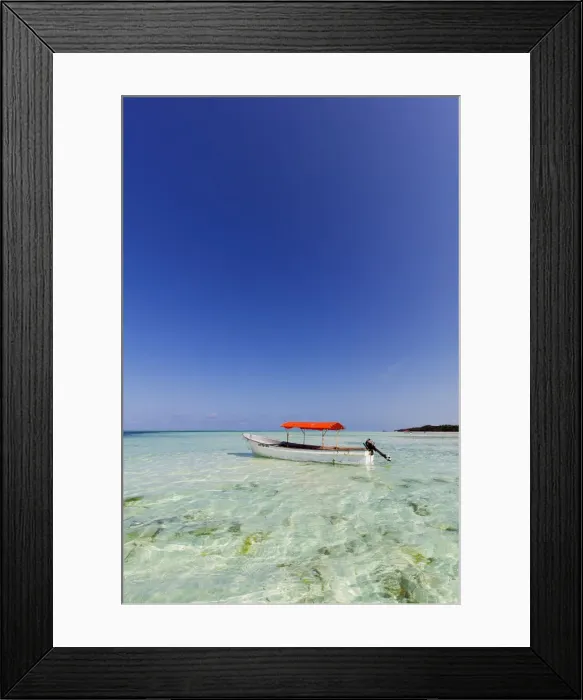 Framed Print : Small boat in crystal clear water, Pingwe, Island of Zanzibar, Tanzania, East Africa Framed Print : Small boat in crystal clear water, Pingwe, Island of Zanzibar, Tanzania, East Africa