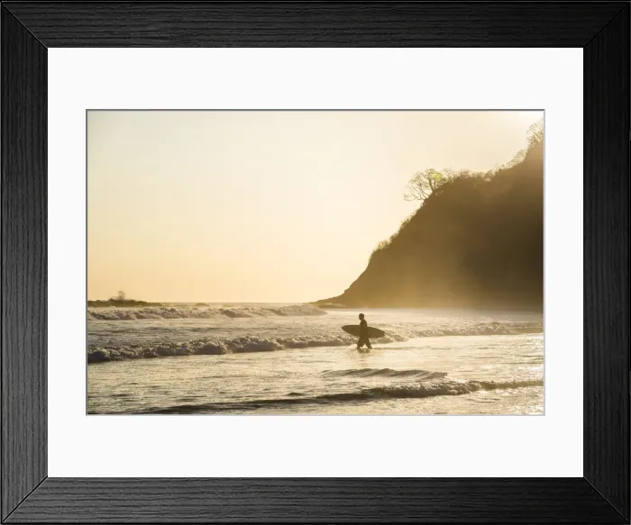 Framed Print : Surfers surfing on a beach at sunset, Nosara, Guanacaste Province, Pacific Coast Framed Print : Surfers surfing on a beach at sunset, Nosara, Guanacaste Province, Pacific Coast