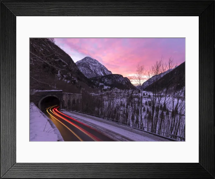 Framed Print : Car trail lights on the icy road at dawn, Campodolcino, Spluga valley, Sondrio province Framed Print : Car trail lights on the icy road at dawn, Campodolcino, Spluga valley, Sondrio province