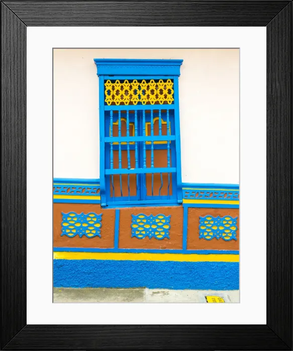 Framed Print : The facade of a colourful building covered in traditional local tiles, in the picturesque Framed Print : The facade of a colourful building covered in traditional local tiles, in the picturesque