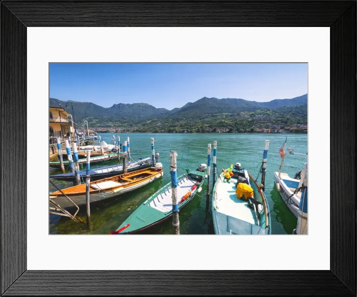 Framed Print : Boats moored at Monte Isola, the largest lake island in Europe, Province of Brescia Framed Print : Boats moored at Monte Isola, the largest lake island in Europe, Province of Brescia