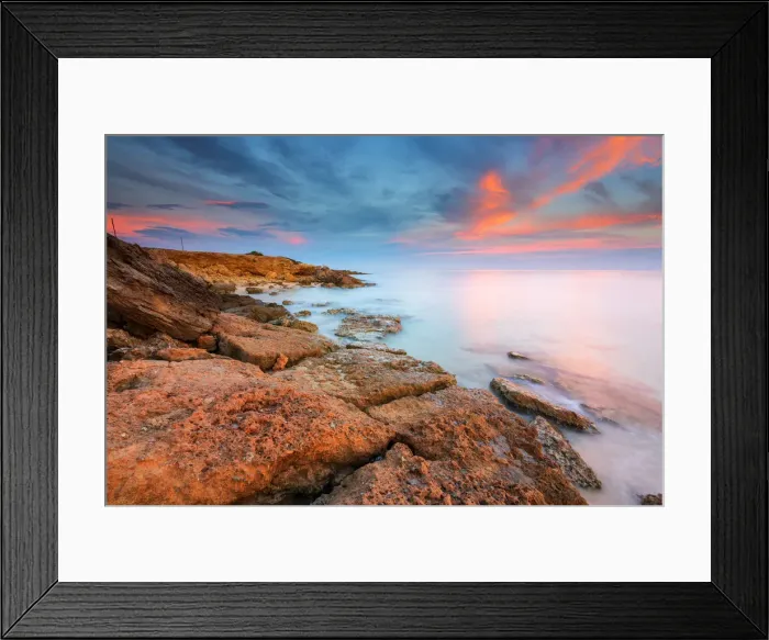 Framed Print : Rocks on the Salento coast at sunset, Dunes of Campomarino, Taranto province, Apulia Framed Print : Rocks on the Salento coast at sunset, Dunes of Campomarino, Taranto province, Apulia