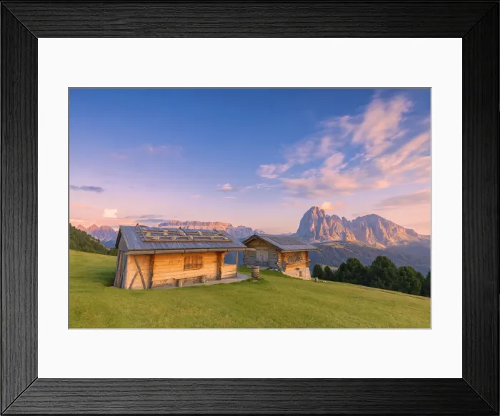 Framed Print : Traditional huts at sunset with Sassolungo and Sella Group in the background. Gardena Valley