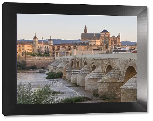 The mosque-cathedral and the Roman bridge at first sunlight, Cordoba, Andalusia, Spain