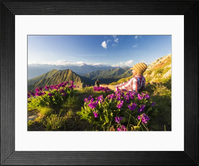 Framed Print : Man lying down on top of Monte Azzarini looks to Monte Disgrazia and Monte Pedena Framed Print : Man lying down on top of Monte Azzarini looks to Monte Disgrazia and Monte Pedena