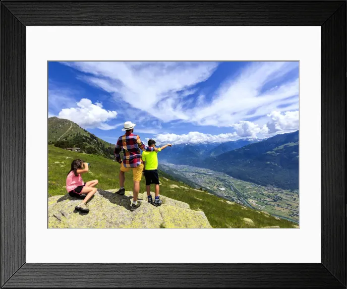 Framed Print : Father and children enjoy the view towards Morbegno from Alpe Bassetta, Lower Valtellina Framed Print : Father and children enjoy the view towards Morbegno from Alpe Bassetta, Lower Valtellina