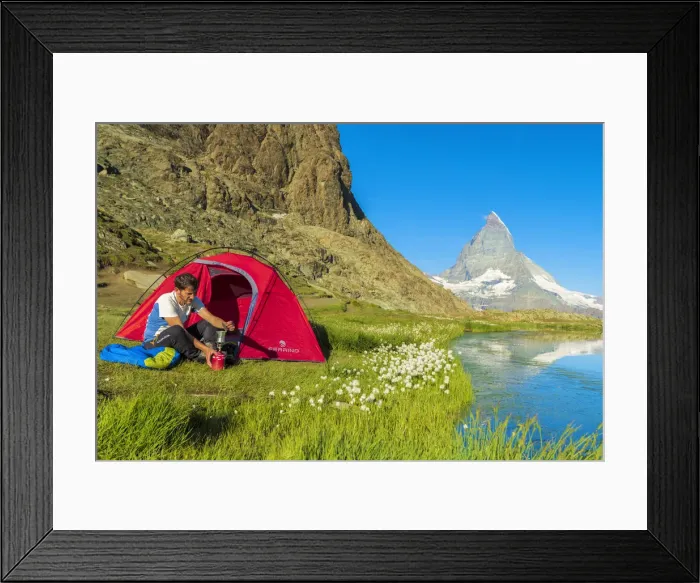 Framed Print : Hiker at lake Riffelsee makes coffee out of the tent facing Matterhorn, Zermatt, canton of Valais Framed Print : Hiker at lake Riffelsee makes coffee out of the tent facing Matterhorn, Zermatt, canton of Valais