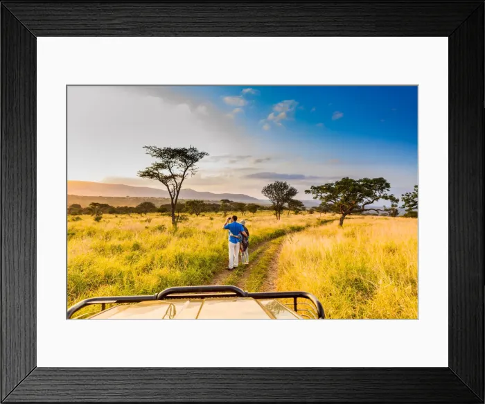 Framed Print : Couple enjoying view at a safari camp, Zululand, South Africa Framed Print : Couple enjoying view at a safari camp, Zululand, South Africa