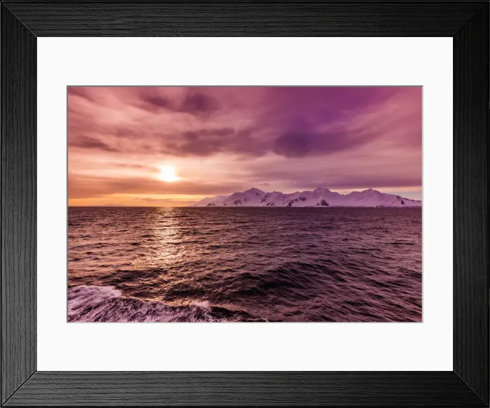 Framed Print : Sunset and a scenic view of the glacial ice and floating icebergs in Antarctica Framed Print : Sunset and a scenic view of the glacial ice and floating icebergs in Antarctica