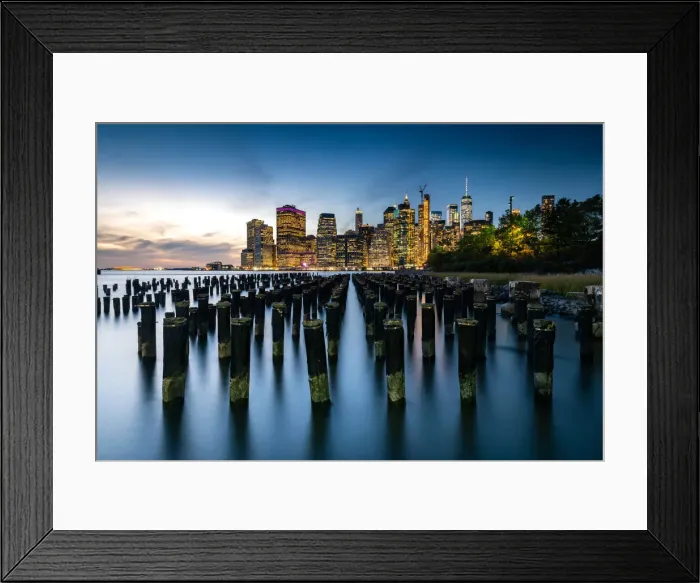 Framed Print : Long exposure of the lights of Lower Manhattan during the evening blue hour as seen Framed Print : Long exposure of the lights of Lower Manhattan during the evening blue hour as seen
