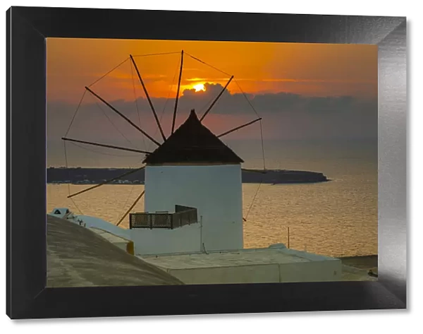 View of windmill at sunset in Oia village, Santorini, Aegean Island, Cyclades Island