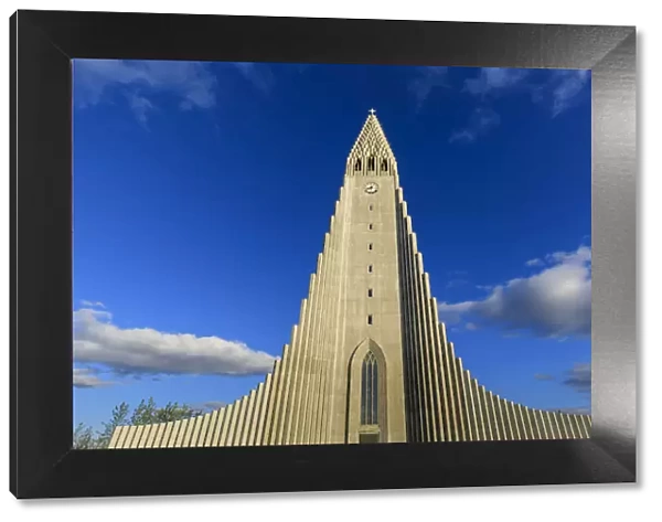 Exterior view of Hallgrimskirkja, the largest Lutheran church in Reykjavik, blue sky