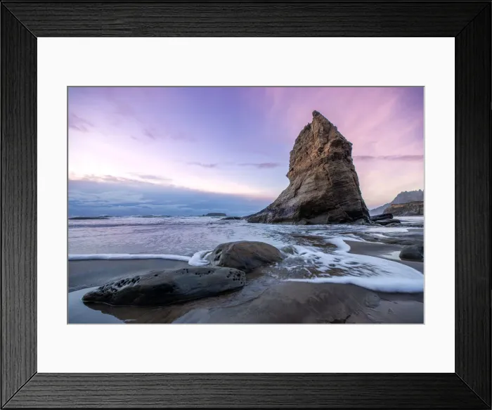 Framed Print : A Seastack with a subtle sunset on the ocean Framed Print : A Seastack with a subtle sunset on the ocean