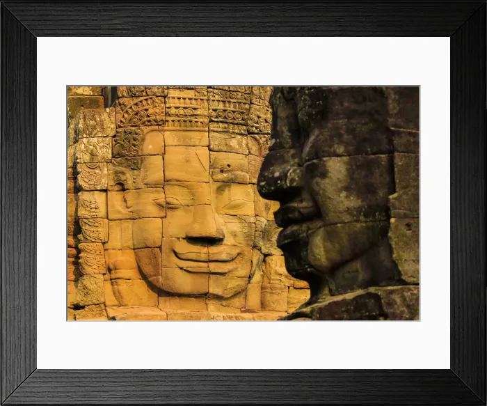 Framed Print : Two of 216 smiling sandstone faces at 12th century Bayon, King Jayavarman VIIs last Framed Print : Two of 216 smiling sandstone faces at 12th century Bayon, King Jayavarman VIIs last