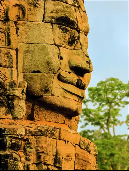 One of 216 smiling sandstone faces at 12th century Bayon, King Jayavarman VIIs last