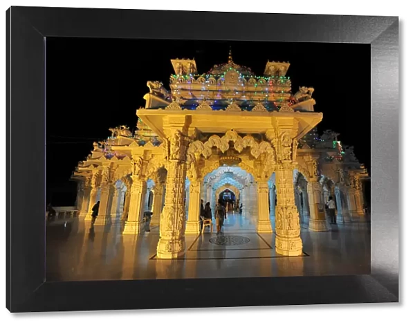 Entrance to the beautiful white marble Swaminarayan Temple, illuminated for evening