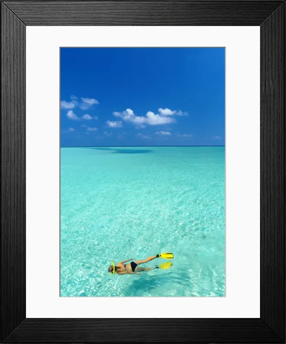 Framed Print : Young woman snorkelling in Maldives, Indian Ocean Framed Print : Young woman snorkelling in Maldives, Indian Ocean
