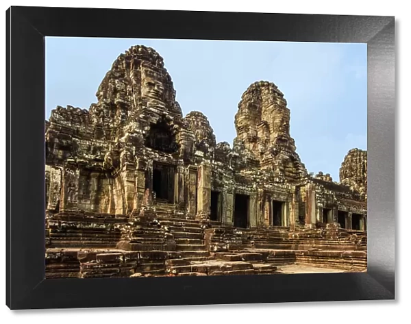 West inner gallery towers and seven of the 216 carved faces at Bayon temple in Angkor