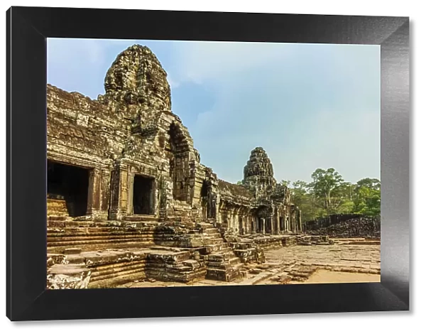 West inner gallery towers and four of the 216 carved faces at Bayon temple in Angkor