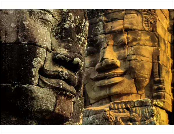 T wo of 216 smiling sandstone faces at 12th century Bayon, King Jayavarman VII s