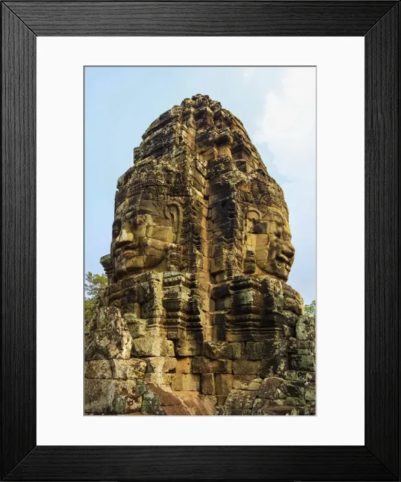 Framed Print : Tower with two of the 216 smiling sandstone faces at 12th century Bayon temple in Framed Print : Tower with two of the 216 smiling sandstone faces at 12th century Bayon temple in