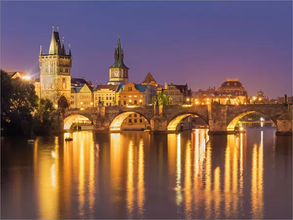 Prague Charles bridge, Old town bridge tower and river Vltava at night, UNESCO World