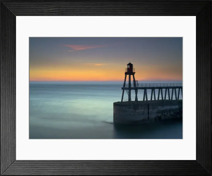 Framed Print : Daybreak over Whitby East Pier and lighthouse, North Yorkshire, England, United Kingdom Framed Print : Daybreak over Whitby East Pier and lighthouse, North Yorkshire, England, United Kingdom