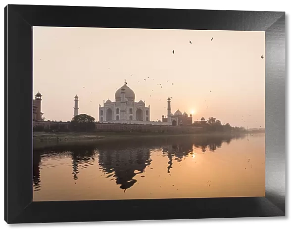 Taken from a boat on the River Yamuna behind the Taj Mahal at sunset, UNESCO World